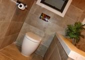 Concealed toilet suite