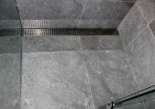 Tiled shower base with cutom grate